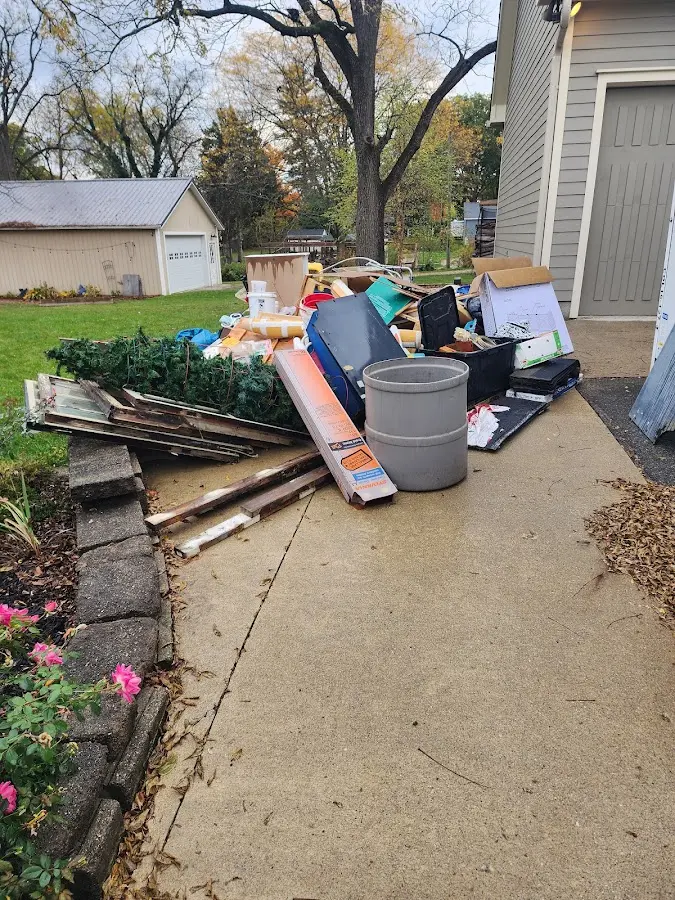 Dumpster being loaded with debris for Estate Cleanout Dumpster Rental in Kingsbury